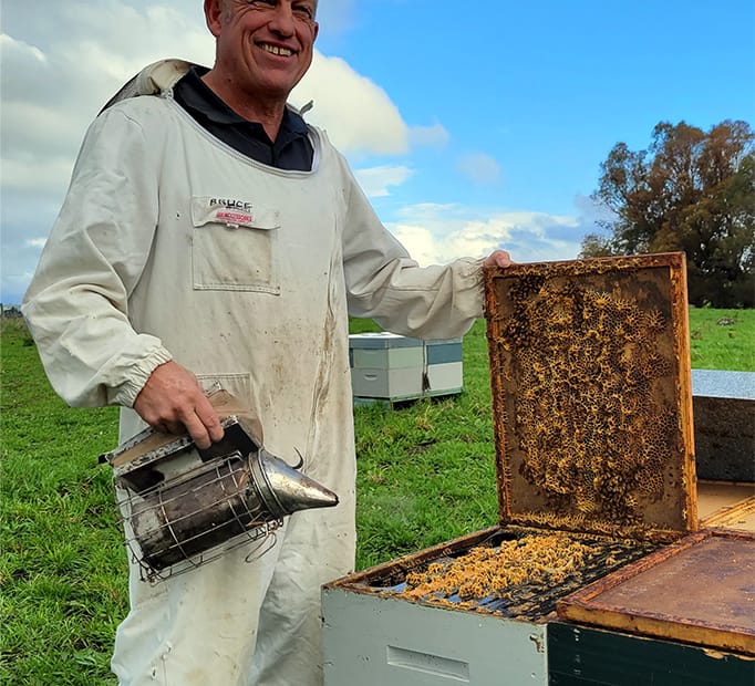Bruce Lowe servicing hives